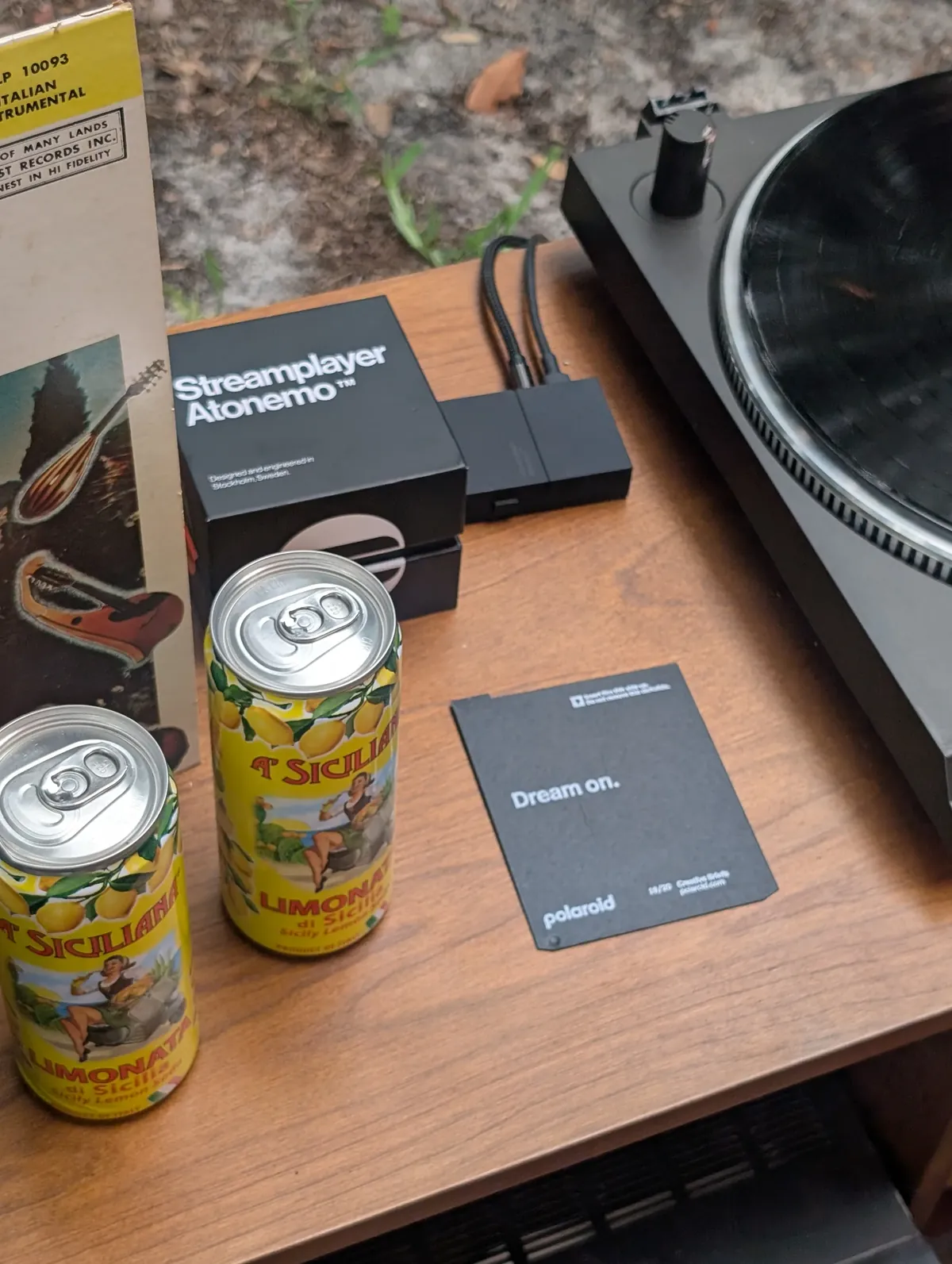 Atonemo Streamplayer beside an Italian instrumental LP and Limonata di Sicilia cans